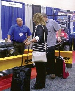 Drew Aloisi, national accounts manager for Meyer Products, talks about the company’s ATV and UTV plows with dealers at the Parts Unlimited National Vendor Presentation in Madison, Wis.