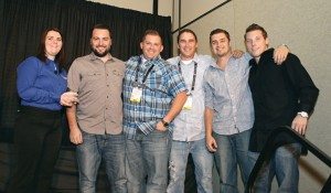 Nate Stickney of DeLand Motorsports in Florida is joined by his team to accept the Power 50 No. 4 dealer award.