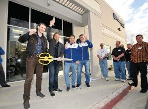 Husqvarna managing director Reinhold Zens (left) enjoys a champagne toast at the ribbon cutting with Jon-Erik Burleson, Brad Hagi and John Hinz.