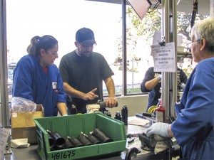 A sign reading “Everyone is an inspector” reminds employees of Fox’s Watsonville, Calif., factory to pay close attention to each piece they’re assembling.
