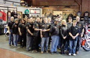 The staff at Cole Harley-Davidson, including general manager Chaz Cole, center, pose with their 2013 Power 50 award.